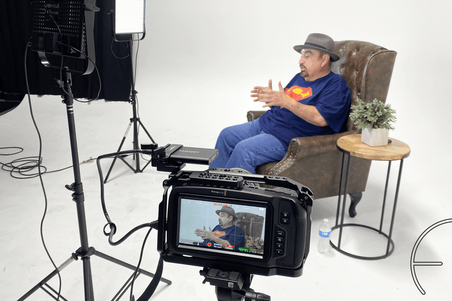 Ken Davitian gesturing towards the camera