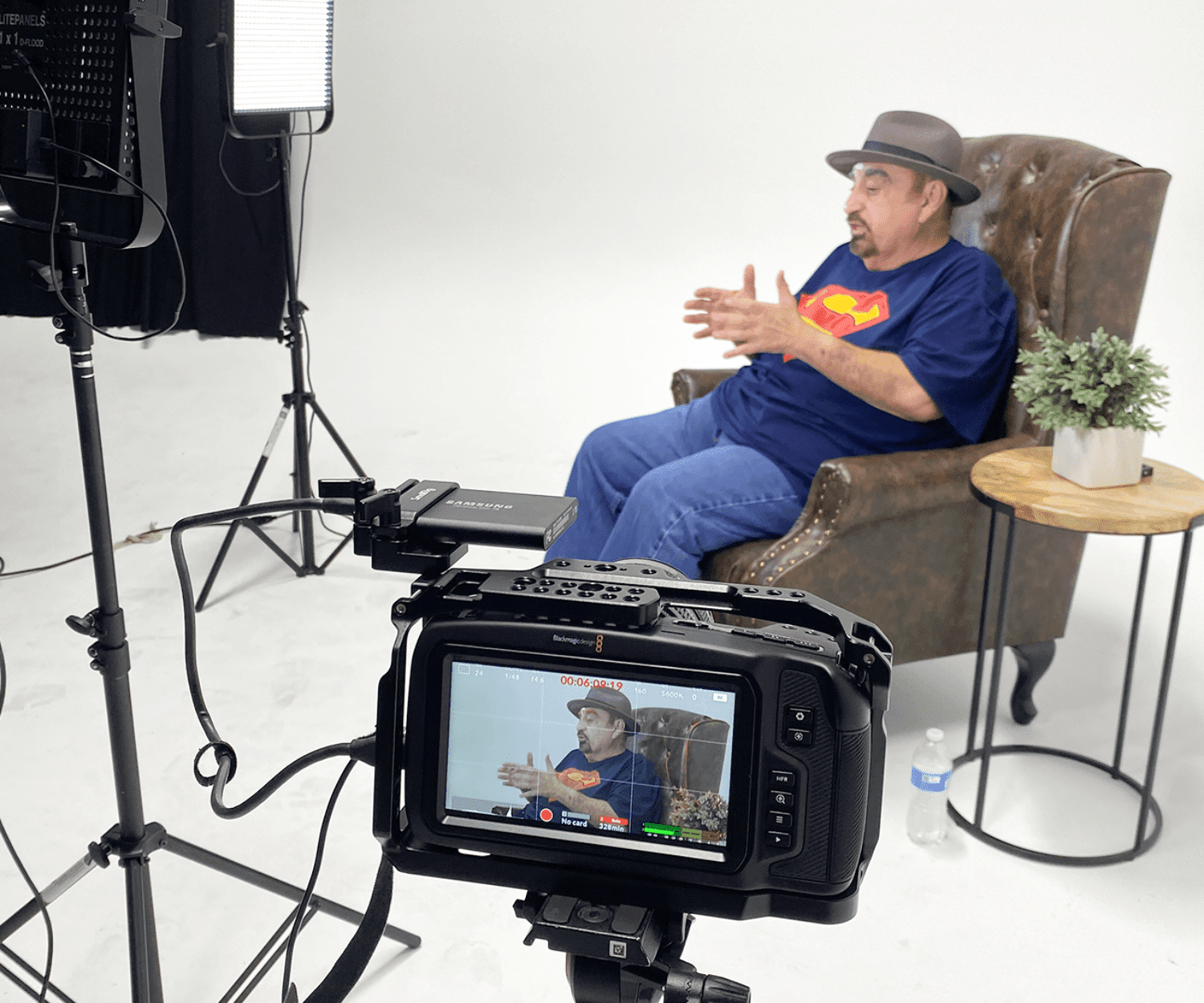 Ken Davitian gesturing towards the camera