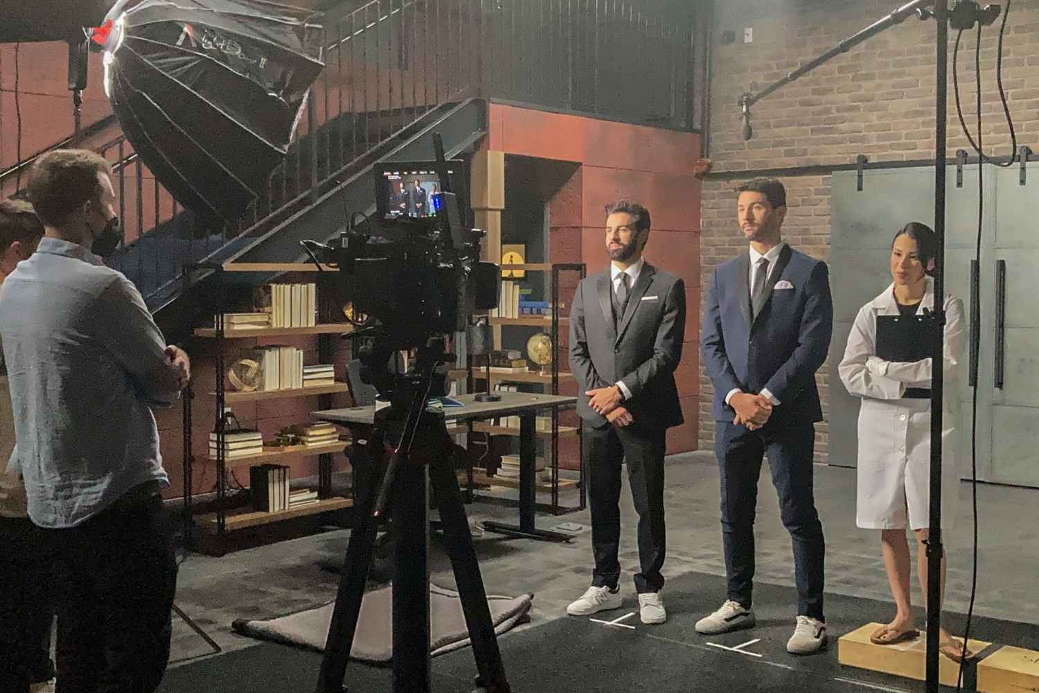 actors stand on set in a set at the film hub