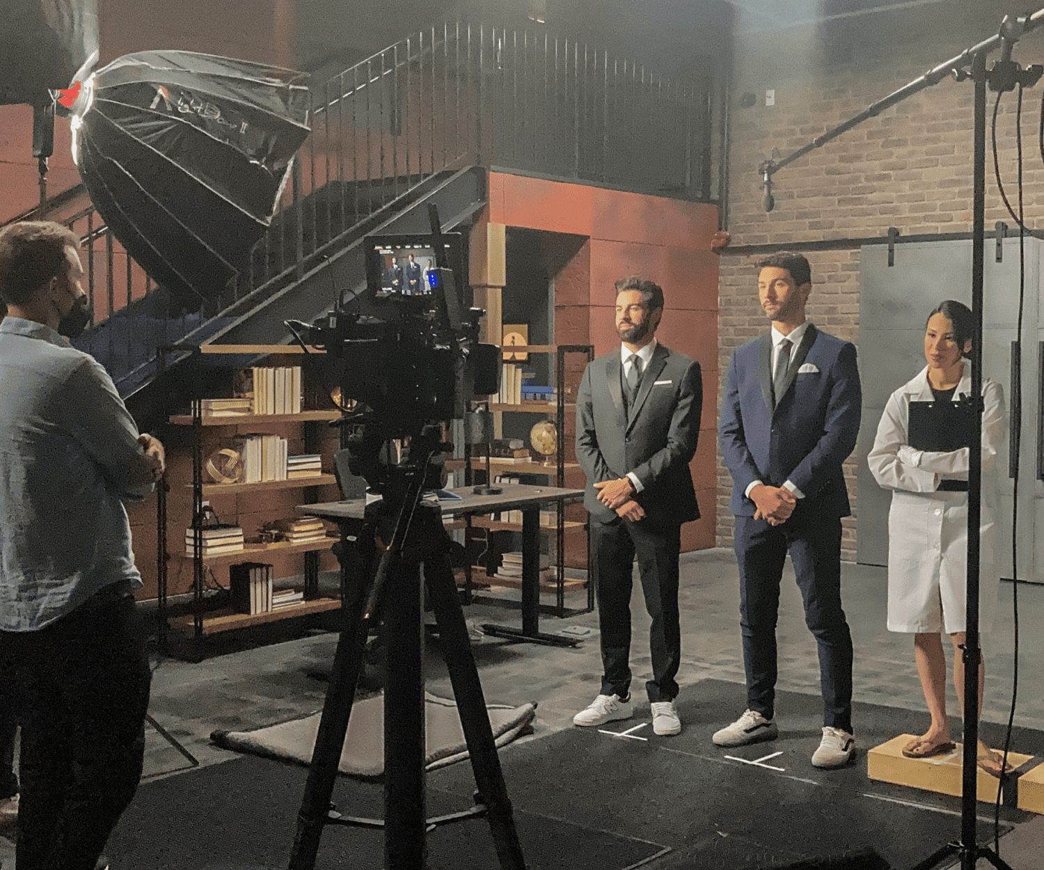 actors stand on set in a set at the film hub