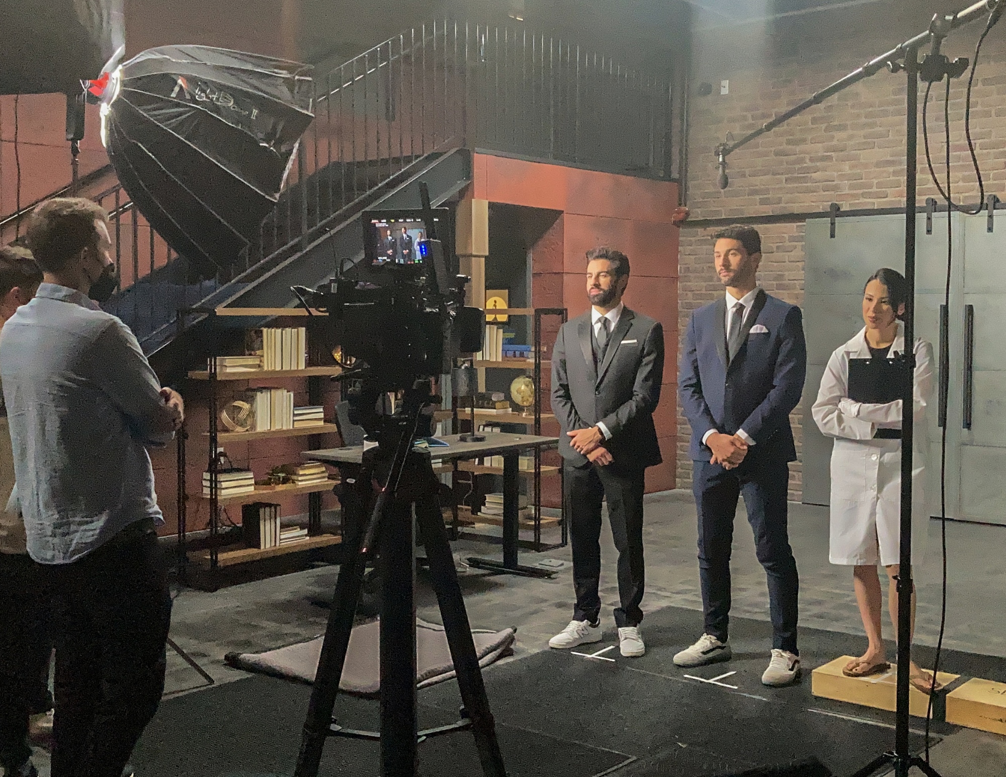 actors stand on set in a set at the film hub