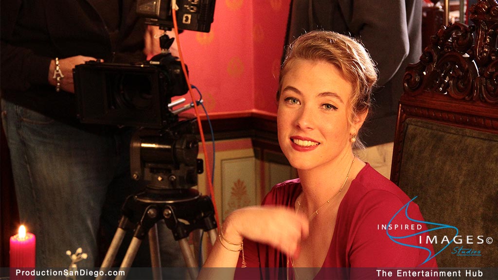 actress poses for camera on set of Refuge of the Storm