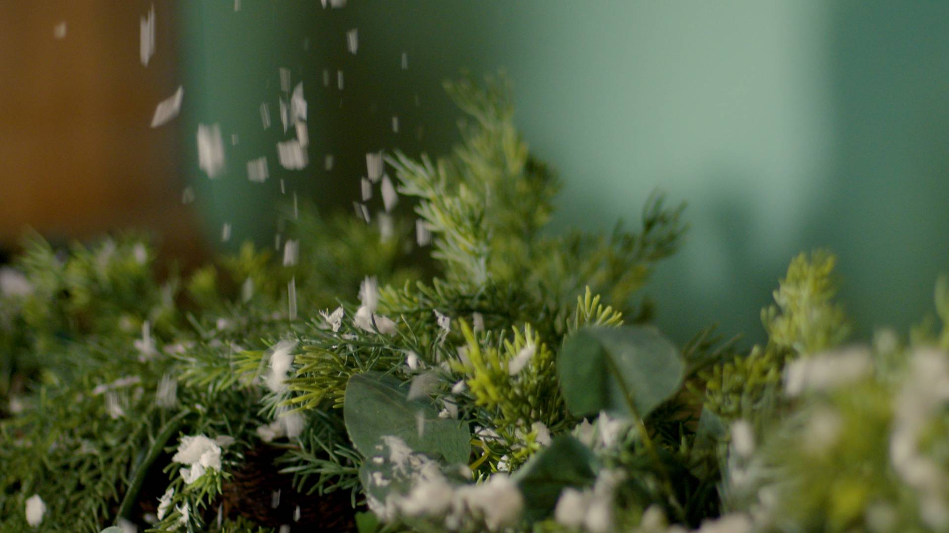 sprinkling of fake snow on garland