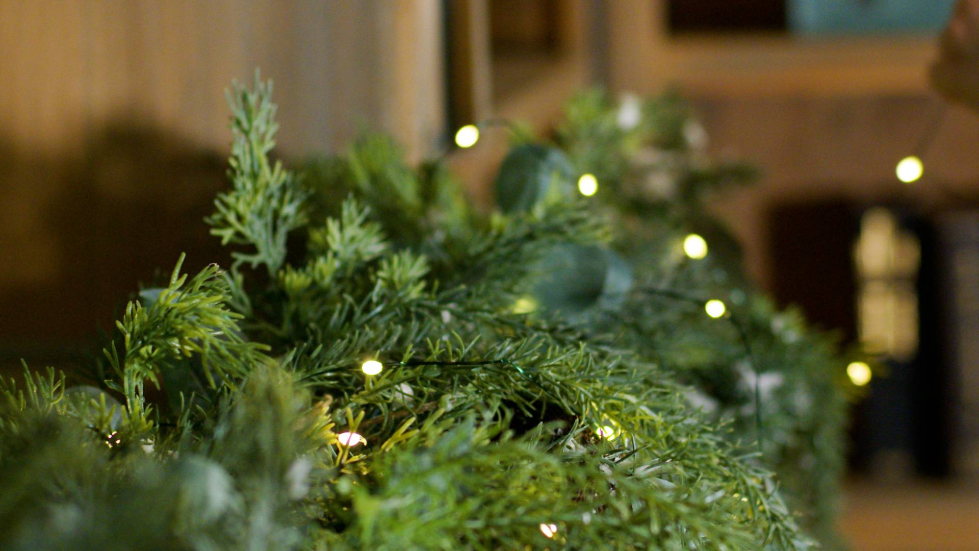 closeup of film hub garland adorned with fairy lights