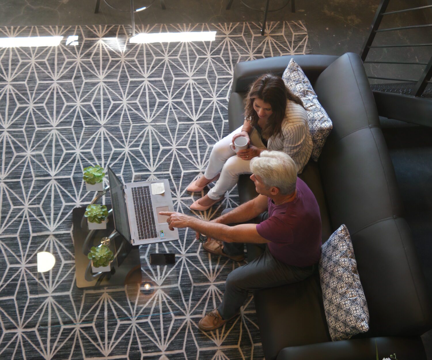 Jim Ellis and Lauren Fehlhaber looking at a laptop