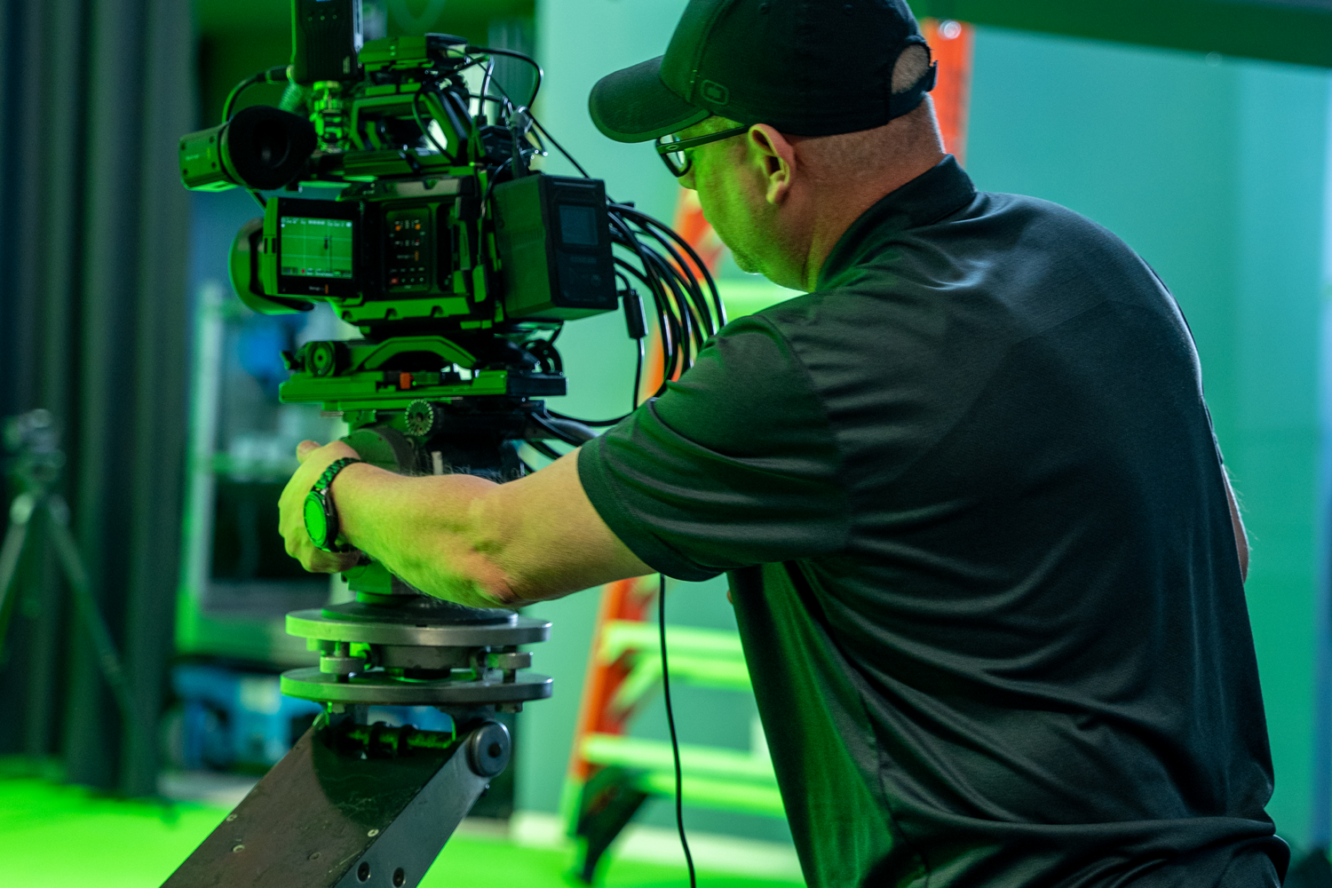 man behind a camera during production shoot