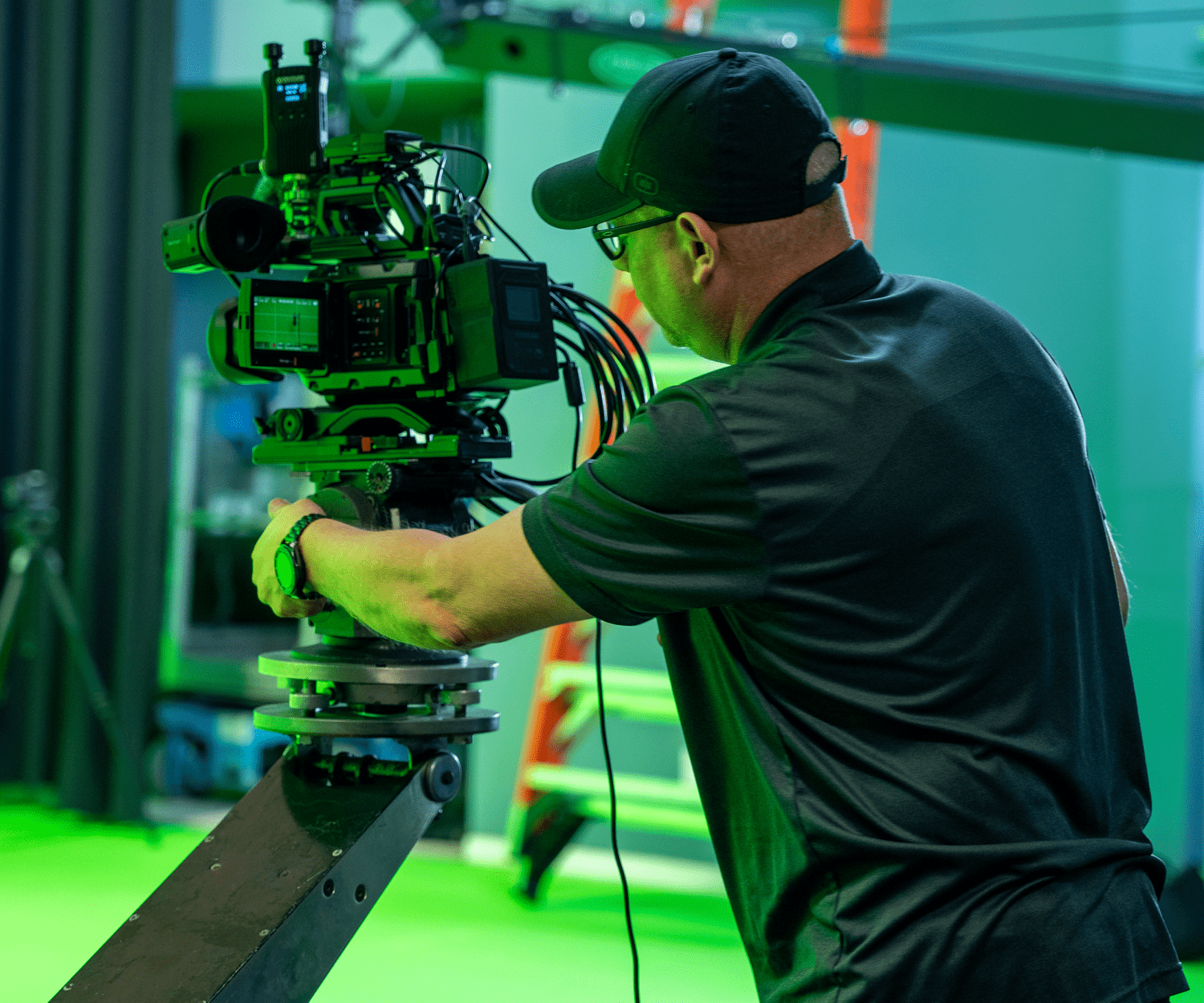 man behind a camera during production shoot