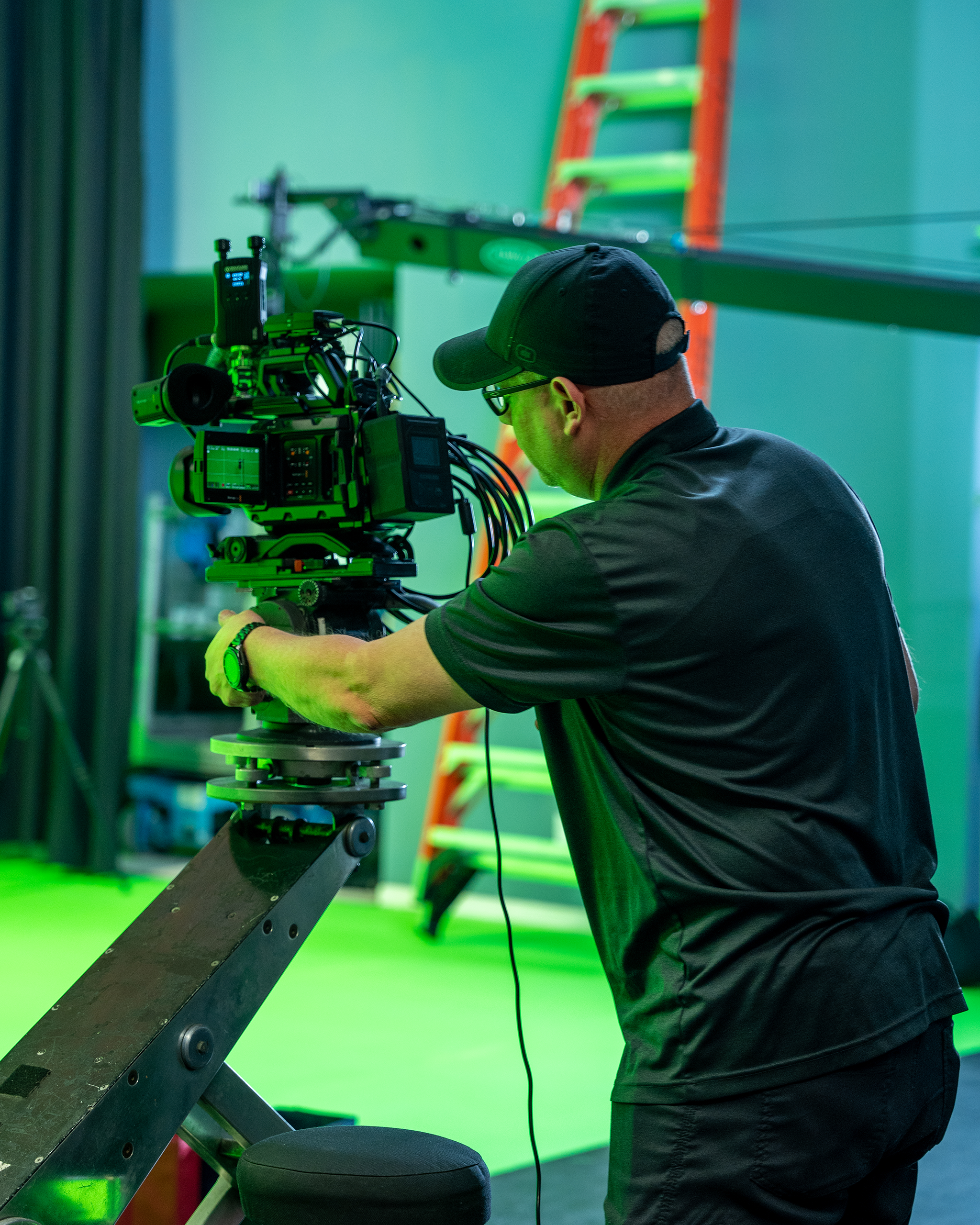 man behind a camera during production shoot