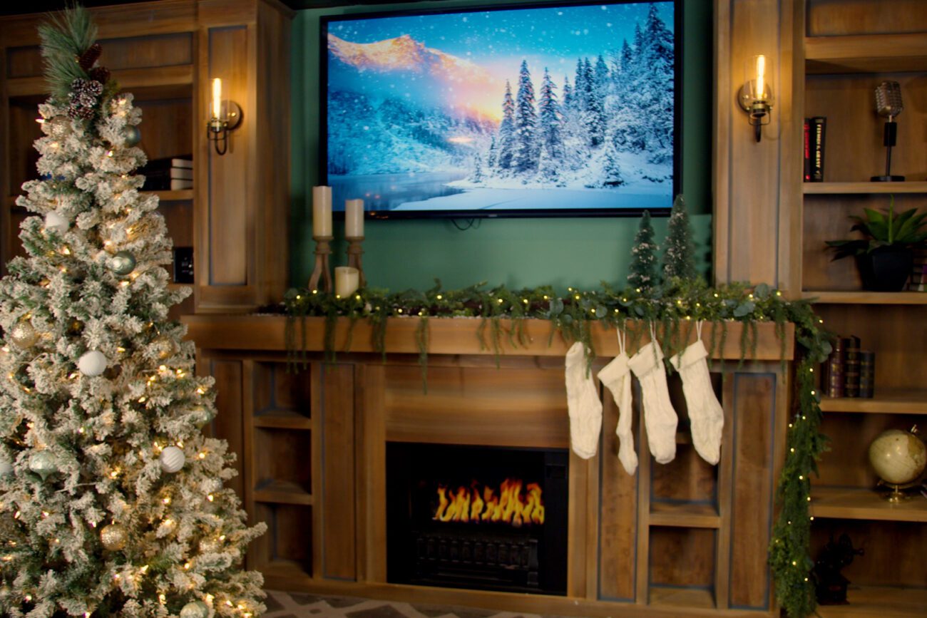 Holiday-themed set at The Film Hub, featuring a decorated Christmas tree, faux fireplace, stockings, and cozy backdrop — perfect for seasonal photo shoots, festive commercials, and holiday content production.